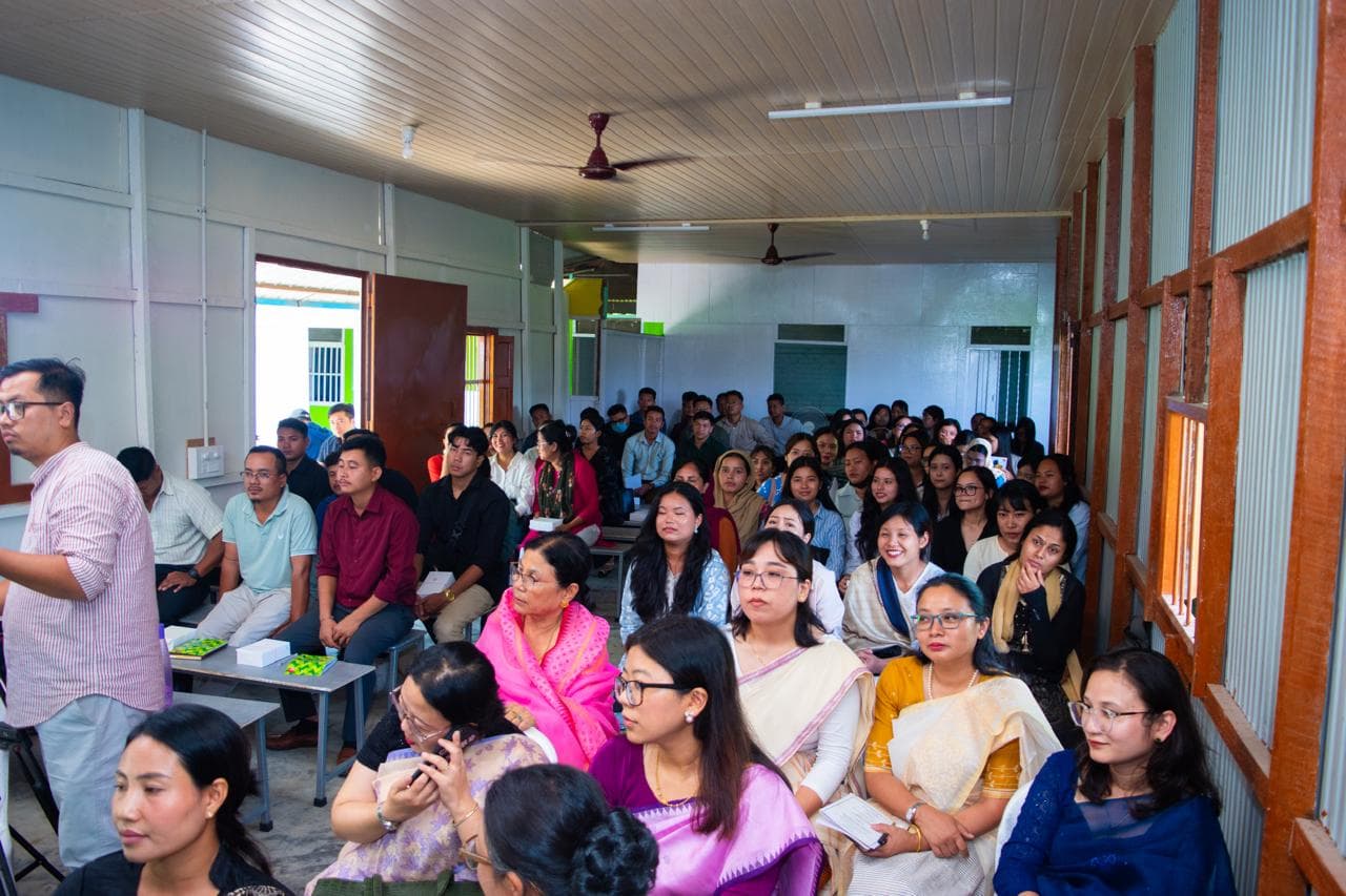 Orientation hall filled with teacher trainees and faculty